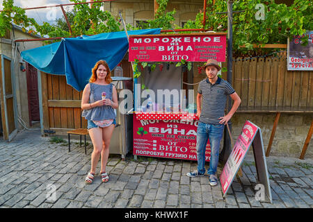 MTSKHETA, GEORGIA - 31 JULY 2017: Young woman tasting genuine icecream made from wine Stock Photo