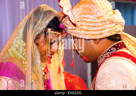 Bride and groom at Haldi ceremony a couple days before a Hindu wedding Stock Photo