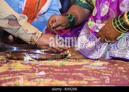 Bride and groom at Haldi ceremony a couple days before a Hindu wedding Stock Photo
