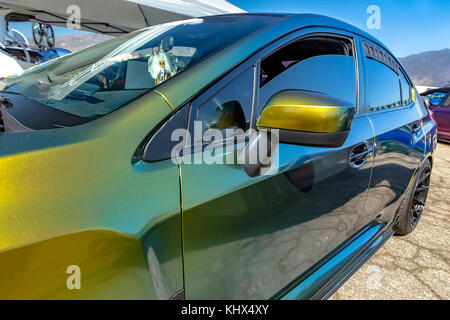 Green metallic car with tinted windows from the front driver's door. Custom cars in Southern California summer 2017 Stock Photo