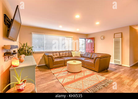 Living room with wrap around couch in San Diego. Wonderful California home in San Diego county. Real estate listings with powerful visuals. Stock Photo