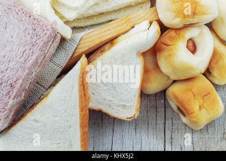 Many breads on the wooden table. Stock Photo
