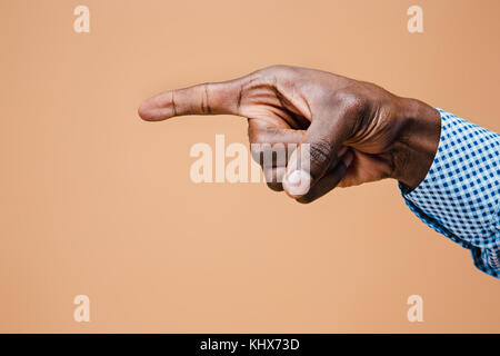 Black male hand point finger. Hand gestures - man pointing on virtual object Stock Photo