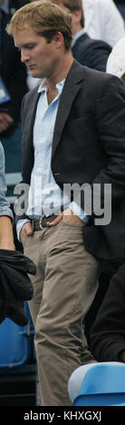 LONDON, ENGLAND - JUNE 09: Pippa Middleton with George Percy leaves centre court as rain delays play during the Men's Singles third round match between Andy Roddick of the United States and Kevin Anderson of South Africa on day four of the AEGON Championships at Queens Club.  Now that Pippa Middleton has parted from her banker boyfriend, handsome former cricketer Alex Loudon, the arduous task of consoling Her Royal Hotness appears to have fallen to an extremely eligible young bachelor: one George Percy.  on June 9, 2011 in London, England  People:  Pippa Middleton George Percy Stock Photo