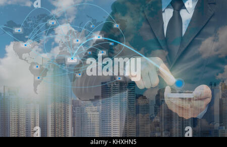Double exposure of businessman using the smart phone with sending the email via network line on cityscape background, business concept Stock Photo