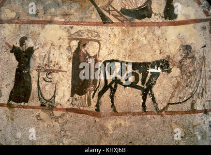 Painted slab from Tomb 47 of Necropolis, Paestum. Circa 350 BC. Preparations for an animal sacrifice. Italy. (Magna Graecia). Archaeological Museum of Paestum. Italy. Stock Photo