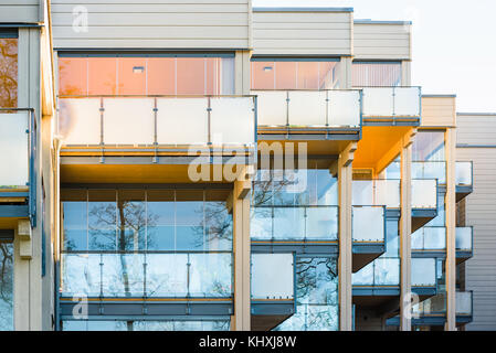 Vaxjo, Sweden - November 13, 2017: Documentary of everyday life and environment. Glass fenced balconies on wooden apartment buildings. Stock Photo