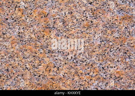 Closeup of a natural unpolished granite marble surface pattern texture. Stock Photo