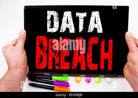 Writing showing Data Breach made in the office with surroundings laptop marker pen. Business concept for Tech Internet Network Breaking into Database  Stock Photo