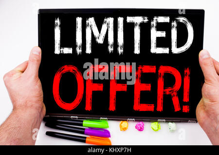 Limited Offer text written on tablet, computer in the office with marker, pen, stationery. Business concept for Limited Time Sale white background wit Stock Photo