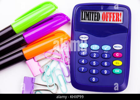 Writing word Limited Offer text in the office with surroundings such as marker, pen writing on calculator Business concept for Limited Time Sale white Stock Photo