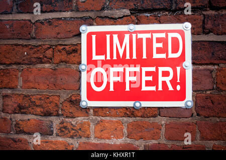 Hand writing text caption inspiration showing Limited Offer concept meaning Limited Time Sale written on old announcement road sign with background an Stock Photo
