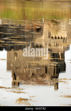 Water reflections of Eilean Donan castle situated on island of Eilean Donan facing Loch Duich in Scotland. Stock Photo
