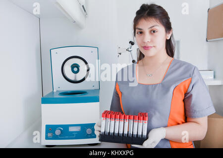 Woman working in dental laboratory Stock Photo