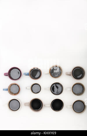 Twelve mugs of coffee isolated on white background with copy space Stock Photo