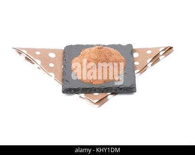 Cocoa powder on shale and white Stock Photo