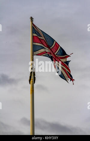 A slightly worn out Union Flag, flying in Babbacombe near Torquay, Devon, UK. Stock Photo