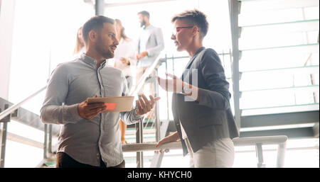 Business colleagues having conversation during coffee break Stock Photo