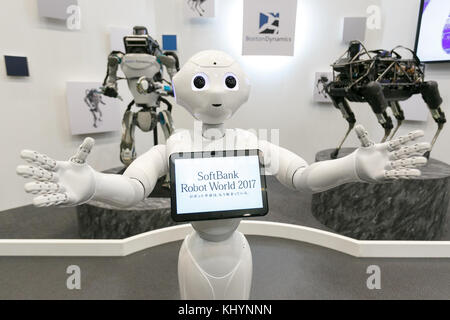 Tokyo, Japan. 21st November, 2017. SoftBank's humanoid robot Pepper and behind Boston Dynamics' robots Atlas (L) and Spot (R) on display during SoftBank Robot World 2017 on November 21, 2017, Tokyo, Japan. SoftBank Robotics organized SoftBank Robot World 2017 to introduce AI (Artificial Intelligence) and IoT (the Internet of Things) companies developing the latest technology for robots, including applications its humanoid robot Pepper in various business fields. The robot expo runs until November 22. Credit: Rodrigo Reyes Marin/AFLO/Alamy Live News Stock Photo