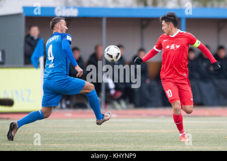 Mainz, Deutschland. 18th Nov, 2017. Nenad SIMIC (li., Schott) versus Sun WEIZHE (CHN), Aktion, duels, Fussball Regionalliga Suedwest, Freundschaftsspiel, TSV Schott Mainz (Schott) - China U20 (CHN) 3:0, am 18.11.2017 in Mainz/ Germany. |usage worldwide Credit: dpa/Alamy Live News Stock Photo