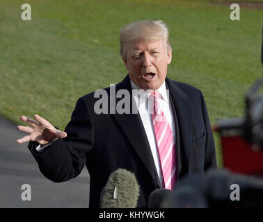 United States President Donald J. Trump speaks to the media on the South Lawn of the White House in Washington, DC prior to his departure for Mar-A-Lago, where he will spend the Thanksgiving holiday, on Tuesday, November 21, 2017. Credit: Ron Sachs/CNP - NO WIRE SERVICE - Photo: Ron Sachs/Consolidated News Photos/Ron Sachs - CNP Stock Photo