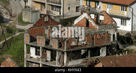 The photo shows a view over Srebrenica with destroyed houses, Bosnia and Herzegovina, 15 November 2006. Srebrenica is located at the border to Serbia. The city's number of inhabitants went down to 21,000, mostly Serbs and Serbian refugees from the Bosnian-Croatian Federation. The city set the sad scene for the massacre in July 1995, when Bosnian Serbs under the commando of General Ratko Mladic invaded the city and slaughtered all male persons they could get hold of under the eyes of Dutch UN troops. Photo: Matthias Schrader | usage worldwide Stock Photo