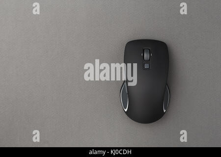 New wireless computer mouse on a gray background Stock Photo