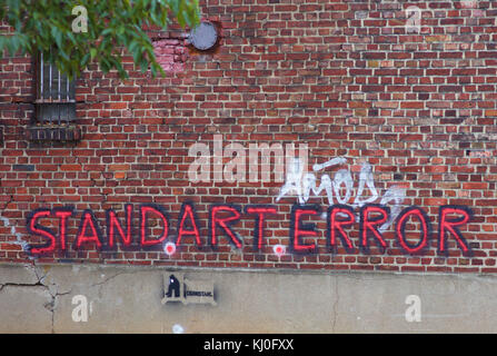 Stand.Art.Error graffiti on brick wall Stock Photo