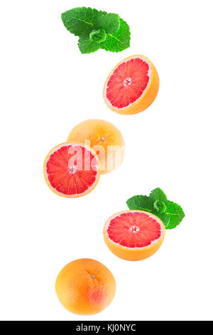 Isolated citrus fruits. Falling grapefruits with mint isolated on white background with clipping path Stock Photo