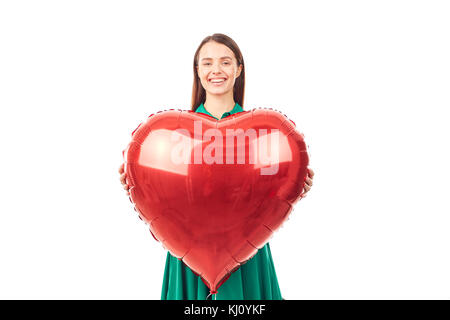 Woman with heart shaped balloon Stock Photo