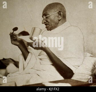 Mohandas Karamchand Gandhi (1869 – 1948) takes a meal before a hunger strike in March 1939. Gandhi was the preeminent leader of the Indian independence movement in British-ruled India. Stock Photo