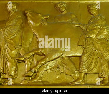 Gilded 19th century replica of the Parthenon frieze. The Frieze was a relief in pentelic marble, created to adorn the upper part of the Parthenon’s naos. It was sculpted between c. 443 and 438 BC, most likely under the direction of Phidias Stock Photo