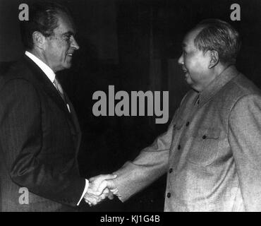 US President Richard Nixon meets Chinese Communist Party leader Chairman Mao Zedong or Mao Tse-tung (1893 – 1976), during the American President's visit to China in 1972 Stock Photo