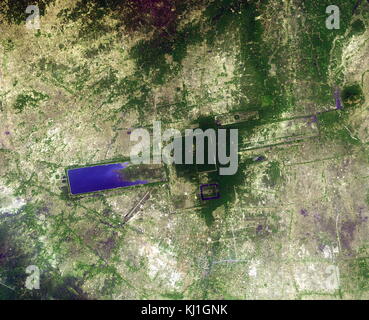 Satellite image of Angkor Wat temple complex in Cambodia is the largest religious monument in the world, with the site measuring 162.6 hectares (1,626,000 m2; 402 acres). It was originally constructed as a Hindu temple of god Vishnu for the Khmer Empire, gradually transforming into a Buddhist temple toward the end of the 12th century. Stock Photo