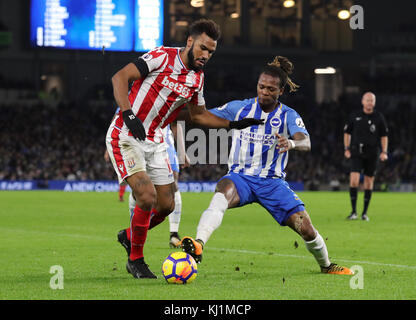Stoke City's Eric Maxim Choupo-Moting (left) and Brighton & Hove Albion's Gaetan Bong battle for the ball during the Premier League match at the AMEX Stadium, Brighton. PRESS ASSOCIATION Photo. Picture date: Monday November 20, 2017. See PA story SOCCER Brighton. Photo credit should read: Gareth Fuller/PA Wire. RESTRICTIONS: No use with unauthorised audio, video, data, fixture lists, club/league logos or 'live' services. Online in-match use limited to 75 images, no video emulation. No use in betting, games or single club/league/player publications. Stock Photo