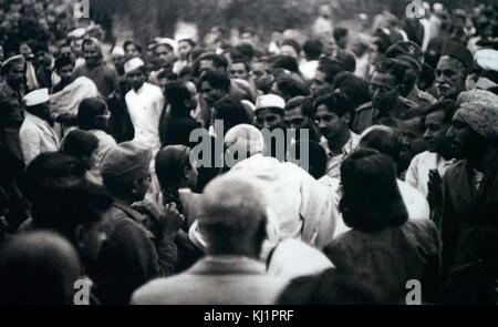 Mohandas Karamchand Gandhi 1869 – 1948) at his last public gathering; Gandhi was the preeminent leader of the Indian independence movement in British-ruled India. At 5:17 pm on 30 January 1948, Gandhi was with his grandnieces in the garden of the former Birla House (now Gandhi Smriti), on his way to address a prayer meeting, when Nathuram Godse fired three bullets from a Beretta 9 mm pistol into his chest at point-blank range Stock Photo