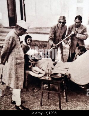 radio broadcast during a hunger strike by Mohandas Karamchand Gandhi (1869 – 1948), in 1947. Stock Photo