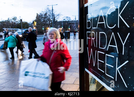 Edinburgh, Scotland, UK. 21st Nov, 2017. In preparation for Black Friday shops in Edinburgh's Princes Street advertise their pre-Christmas sales in order to boost a flagging high street performance. To prevent scenes of chaos many of the retailers have extended their sales up to two weeks in advance of 24th November, the traditional date when US retailers reduced their prices the day after Thanksgiving Day. Credit: Rich Dyson/Alamy Live News Stock Photo