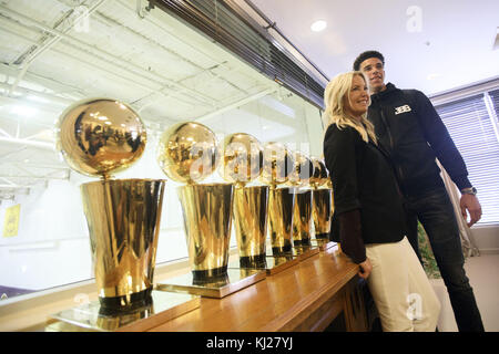 El Segundo, California, USA. 23rd June, 2017. Lakers draft pick Lonzo Ball  stands for a photograph with Magic Johnson and championship trophies at the  Lakers' Practice Facility on Friday, June 23, 2017