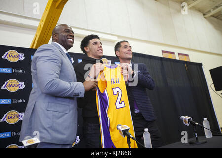 El Segundo, California, USA. 23rd June, 2017. Lakers draft pick Lonzo Ball  and Magic Johnson talk with general manager Rob Pelinka before a press  conference at the Lakers' Practice Facility on Friday