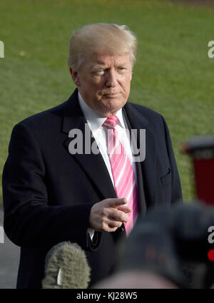 United States President Donald J. Trump speaks to the media on the South Lawn of the White House in Washington, DC prior to his departure for Mar-A-Lago, where he will spend the Thanksgiving holiday, on Tuesday, November 21, 2017. Credit: Ron Sachs / CNP /MediaPunch Stock Photo