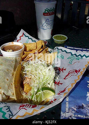 mexican style food taco with seafood and chicken in a serving stand ...