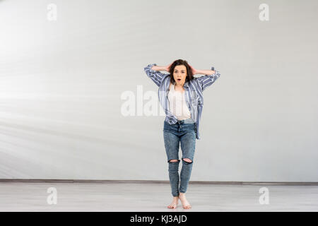 Young pretty dancer posing in studio. Stock Photo