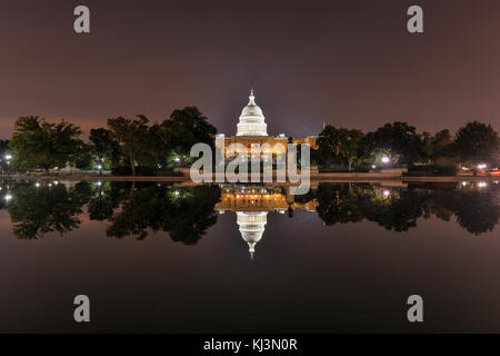 The US Capitol Building as seen across the reflecting pool at night in Washington, DC. Stock Photo