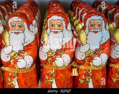 Zurich, Switzerland - 17 Nov 2017: Less than 6 weeks before Christmas, an army of chocolate Santa Clauses is lined up on a supermarket shelf. Stock Photo