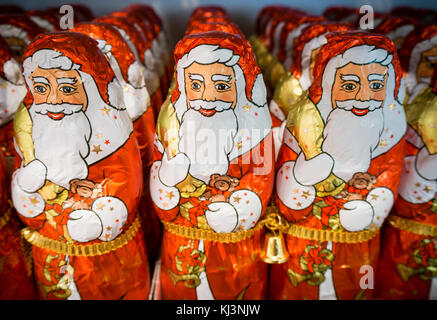 Zurich, Switzerland - 17 Nov 2017: Less than 6 weeks before Christmas, an army of chocolate Santa Clauses is lined up on a supermarket shelf. Stock Photo