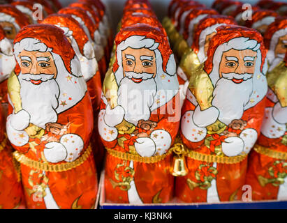 Zurich, Switzerland - 17 Nov 2017: Less than 6 weeks before Christmas, an army of chocolate Santa Clauses is lined up on a supermarket shelf. Stock Photo