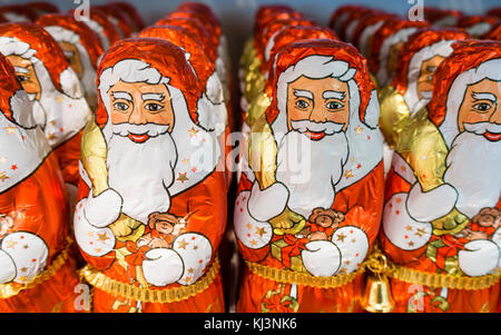 Zurich, Switzerland - 17 Nov 2017: Less than 6 weeks before Christmas, an army of chocolate Santa Clauses is lined up on a supermarket shelf. Stock Photo