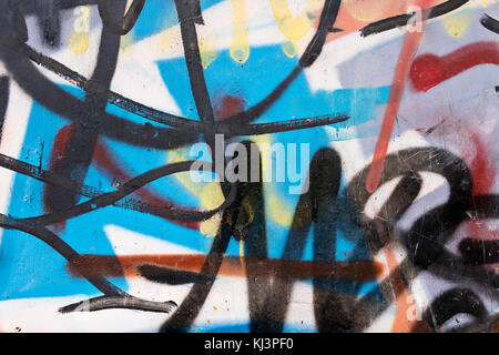 Abstract old chaotic graffiti on a dilapidated wall Stock Photo