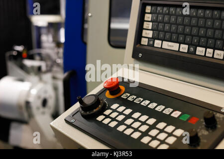 Keyboard on a control panel of CNC metalworking machine. Selective focus. Stock Photo